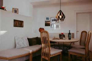 a living room with a table and a couch at Blick auf's Schloss in Itter