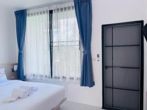 Cama o camas de una habitación en White Seaview Residence