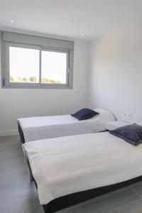 Łóżko lub łóżka w pokoju w obiekcie Modern 3 bedroom apartment in Mijas Costa - Vitta Nature