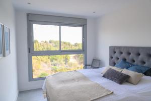 Łóżko lub łóżka w pokoju w obiekcie Modern 3 bedroom apartment in Mijas Costa - Vitta Nature