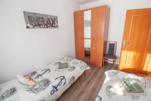 Łóżko lub łóżka w pokoju w obiekcie Apartment Nolan
