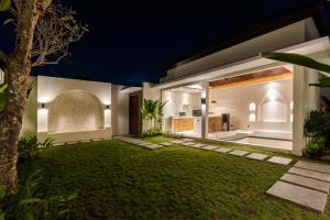 an exterior view of a house at night at J4 Villas Sanur in Sanur
