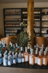 a table topped with lots of bottles of alcohol at Ampersand Estates in Pemberton