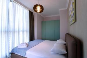 מיטה או מיטות בחדר ב-Season Suite Apart-Hotel