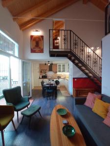 a living room with a couch and a table at Casa Valparaíso Málaga for everybody in Málaga