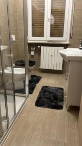 a bathroom with a sink and a toilet and mirrors at -La Casa Di Elio- -Centrale Tra Milano e Como- in Mariano Comense +16 photos