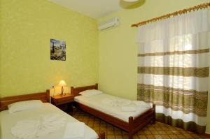 Posteľ alebo postele v izbe v ubytovaní Zambia Apartments
