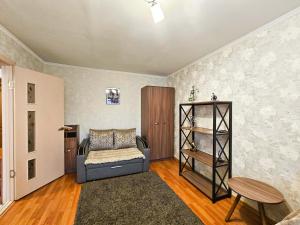 a living room with a couch and a table at Nadezhda Apartments on Gogol st. - Maulenov st. in Almaty