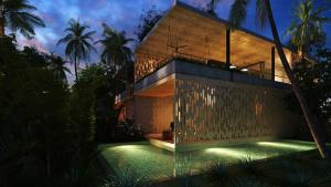 a house with a swimming pool at night at BASK Gili Meno in Gili Meno