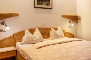 Postel nebo postele na pokoji v ubytování App Hubertus - Sagernock + 8 fotografií