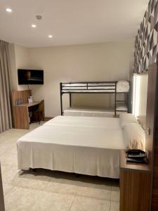 Postel nebo postele na pokoji v ubytování Hotel Camino Real