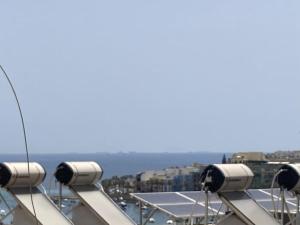 a view from the top of a building with cameras at Elegant Maisonette in Malta by AssetFlow PRO in Marsaskala