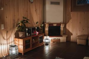 a living room with a tv and a table with a tvictericter at Viljandi Jahiloss in Viljandi