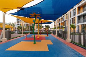 a playground in the middle of a building at Tamm - Mesk 1 Tower in Dubai