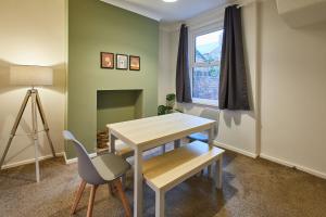 a room with a desk and a chair and a window at Host & Stay - Charlotte Street in Redcar