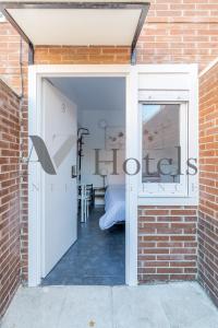 Cama o camas de una habitación en AYZ Ulises - Auto check-in property