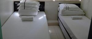 A bed or beds in a room at 金源賓館 Golden Yuan Guest House