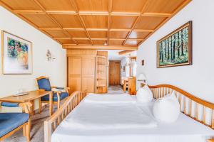 Postel nebo postele na pokoji v ubytování Hotel Garni Nuss