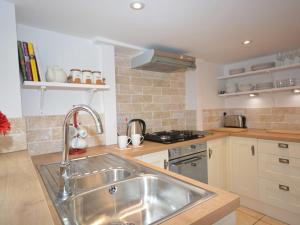 a kitchen with a sink and a stove at 2 Bed in Wells VESPE in Wells