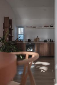 a kitchen with a table and chairs in a room at Apartment Søglas in Gmund am Tegernsee