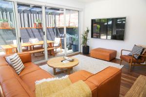 a living room with a couch and a table at Hidden Gem in Bright