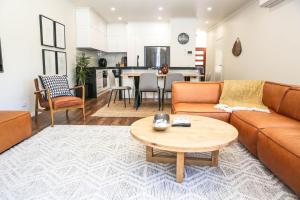 a living room with a couch and a table at Hidden Gem in Bright