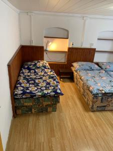 מיטה או מיטות בחדר ב-Horská bouda Šubišák