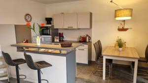 Η κουζίνα ή μικρή κουζίνα στο Park-Apartment Scharmützelsee Wohnung 13