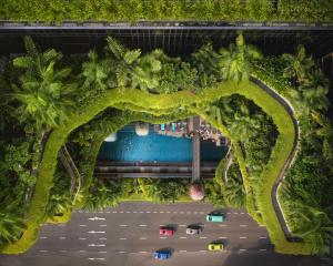 an overhead view of a road with cars and trees at PARKROYAL COLLECTION Pickering, Singapore in Singapore