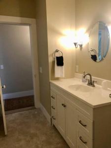 a bathroom with a sink and a mirror at Elegant 2BR Apt w 2 Bathrooms in Historic Hamlet by Berkshires & Hudson Valley, Walk to Restaurants in Hillsdale
