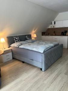 a bedroom with a large bed in a attic at Gemütliche Wohnung am Golfplatz mit Bergblick in St. Wolfgang