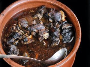 a bowl of soup with a spoon in it at Casa Raposo in Miranda do Corvo
