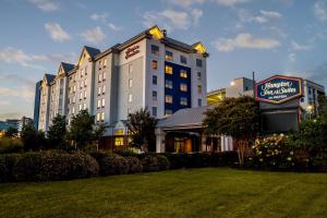 a hotel building with a sign in front of it at Hampton Inn & Suites Nashville-Vanderbilt-Elliston Place in Nashville