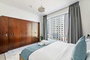 Postel nebo postele na pokoji v ubytování StoneTree - Spacious 1 BR Apartment in Dubai Marina