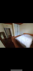 a bedroom with a bed and a mirror at Elgon View House in Eldoret