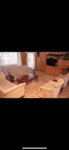 a living room with couches and a table at Elgon View House in Eldoret