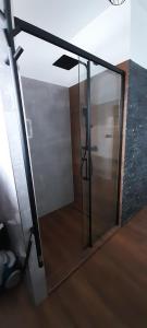 a sliding glass door in a room with a wall at Apartmán Vacovi in Olomouc