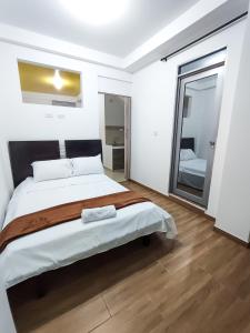 Voodi või voodid majutusasutuse Hotel Maranta toas