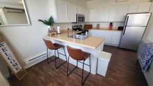 a kitchen with a counter and a refrigerator at Amazing 1 BR Apt In City Center in Detroit