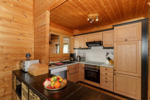 Kuchyň nebo kuchyňský kout v ubytování Ferienhaus Holzperle am Meer