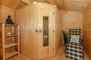 Postel nebo postele na pokoji v ubytování Ferienhaus Holzperle am Meer