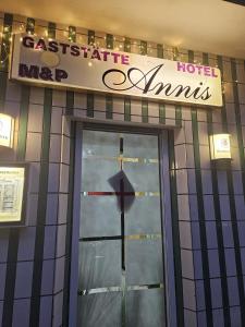 a cross on the front door of a hotel at Hotel Annis M&P in Dortmund