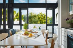 a kitchen with a white table with fruit on it at 22 Eikehoff Apartment in Stellenbosch