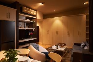 a living room with a couch and a tv at 22 Eikehoff Apartment in Stellenbosch
