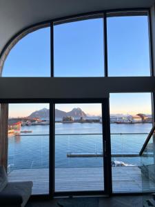 a view of the water from a room with windows at Lofoten Suiteapartments in Svolvær