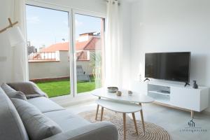 TV a/nebo společenská místnost v ubytování Living4malaga Blue Bay