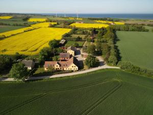 an aerial view of a house in the middle of a field at Pension Stenvang in Onsbjerg