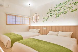 KONJAKUSO Osaka Tengachaya "NIHONCHA" Tea & Relax客房内的一张或多张床位
