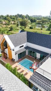 an aerial view of a house with a swimming pool at F&F pool villa Rayong in Rayong