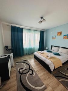 En eller flere senge i et værelse på Guest House Zoreni